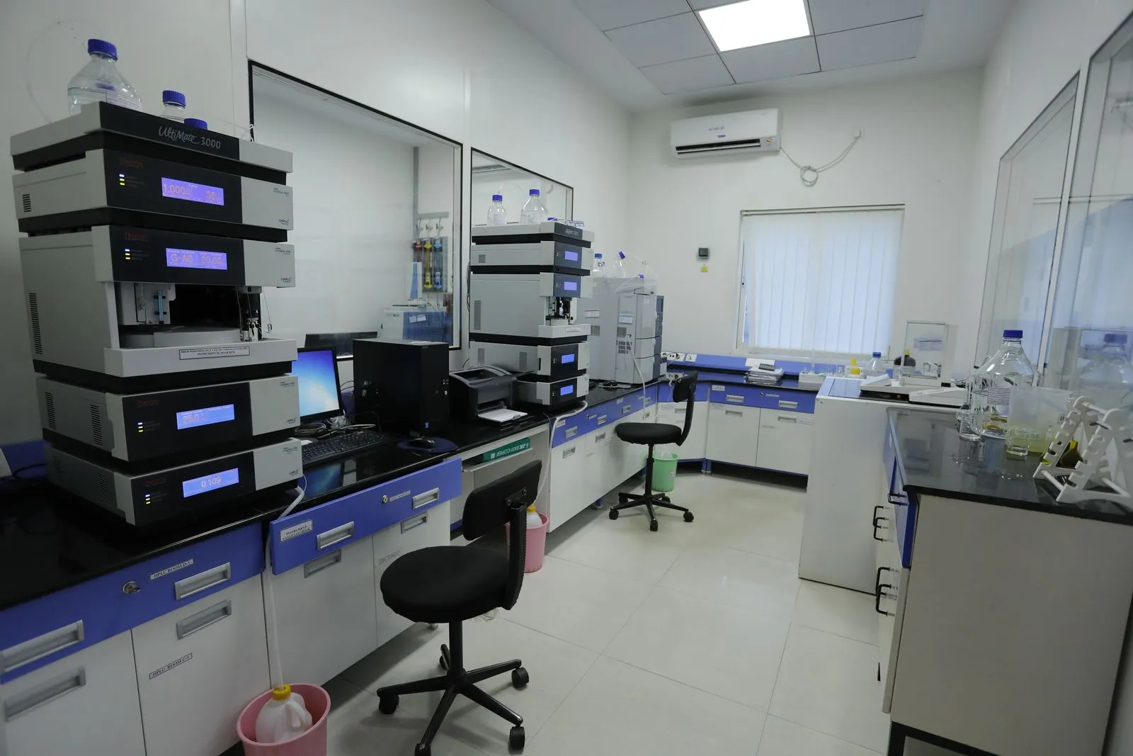 Instruments along a laboratory bench at Exemed